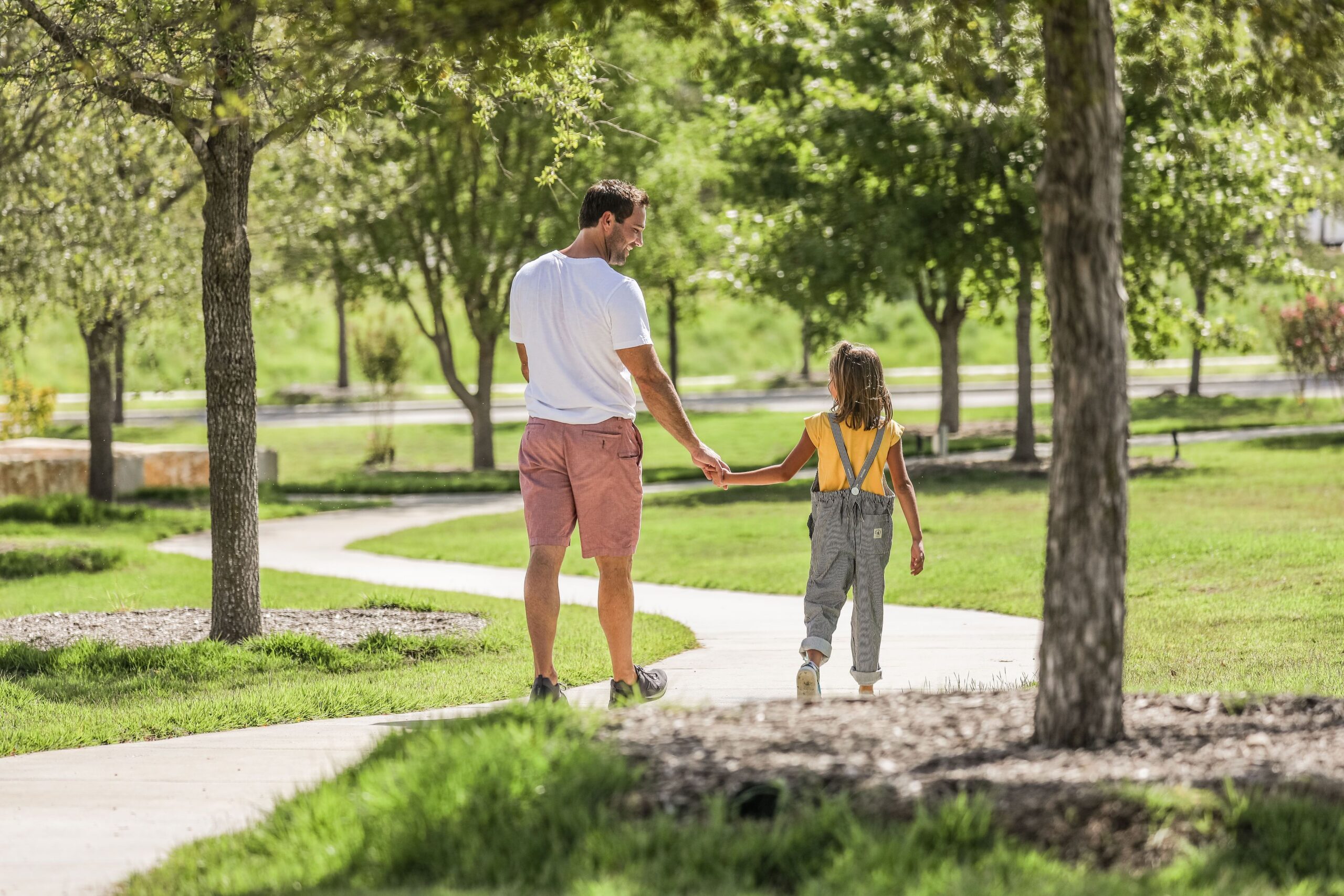 father and daughter walking